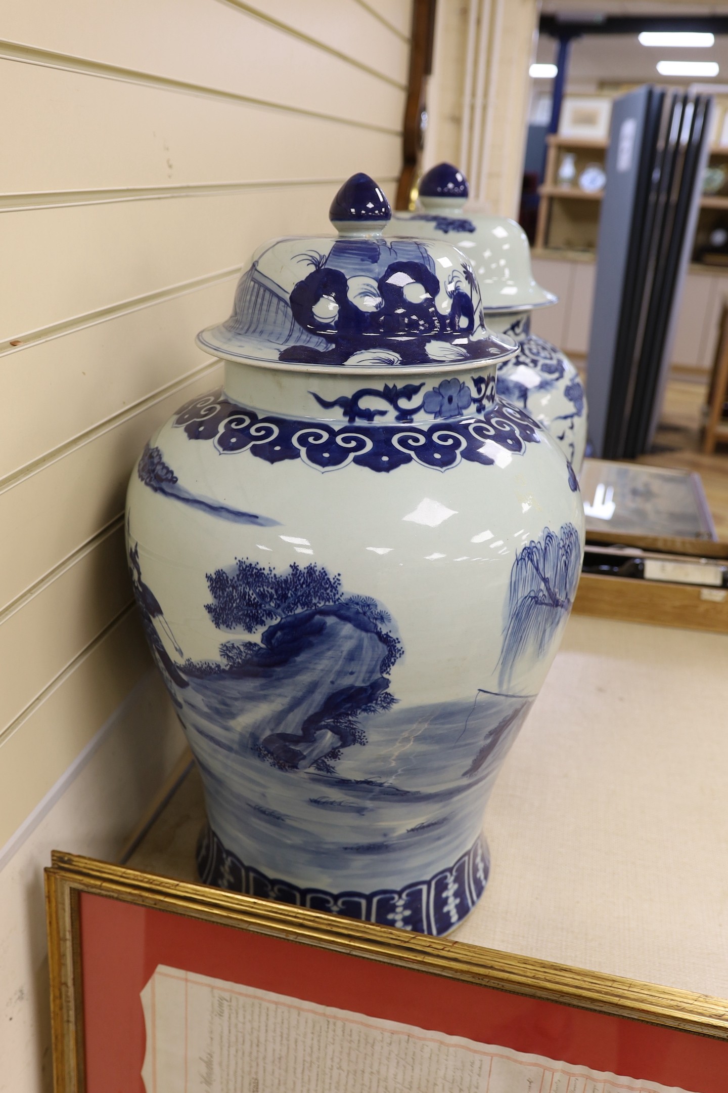 A pair of large Chinese blue and white jars and covers, 75 cms high.